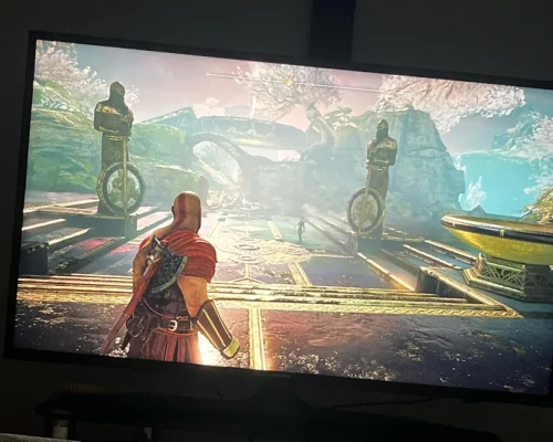 A picture of a gamer playing God of War